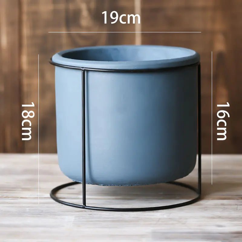 A large Decorative Succulent Planter with Iron Stand measuring 19cm in diameter. The overall height is 18cm.