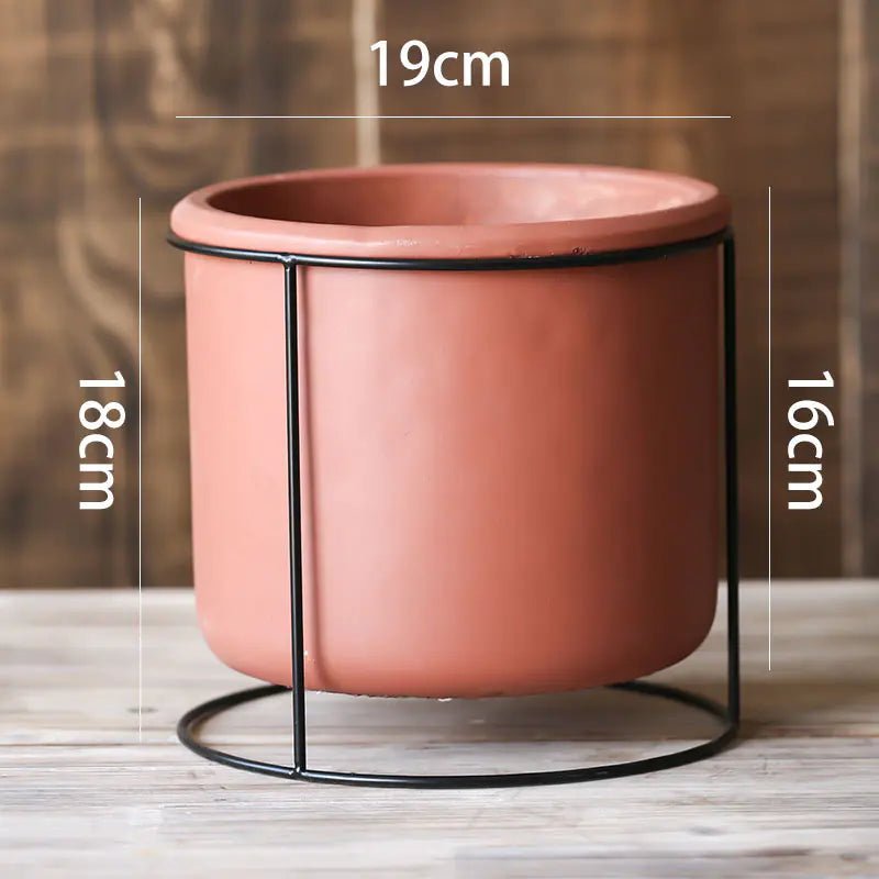 A large Decorative Succulent Planter with Iron Stand measuring 19cm in diameter. The overall height is 18cm.