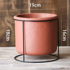 A large Decorative Succulent Planter with Iron Stand measuring 19cm in diameter. The overall height is 18cm.