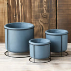 Set of 3 Decorative Succulent Planters with Iron Stands in varying sizes.