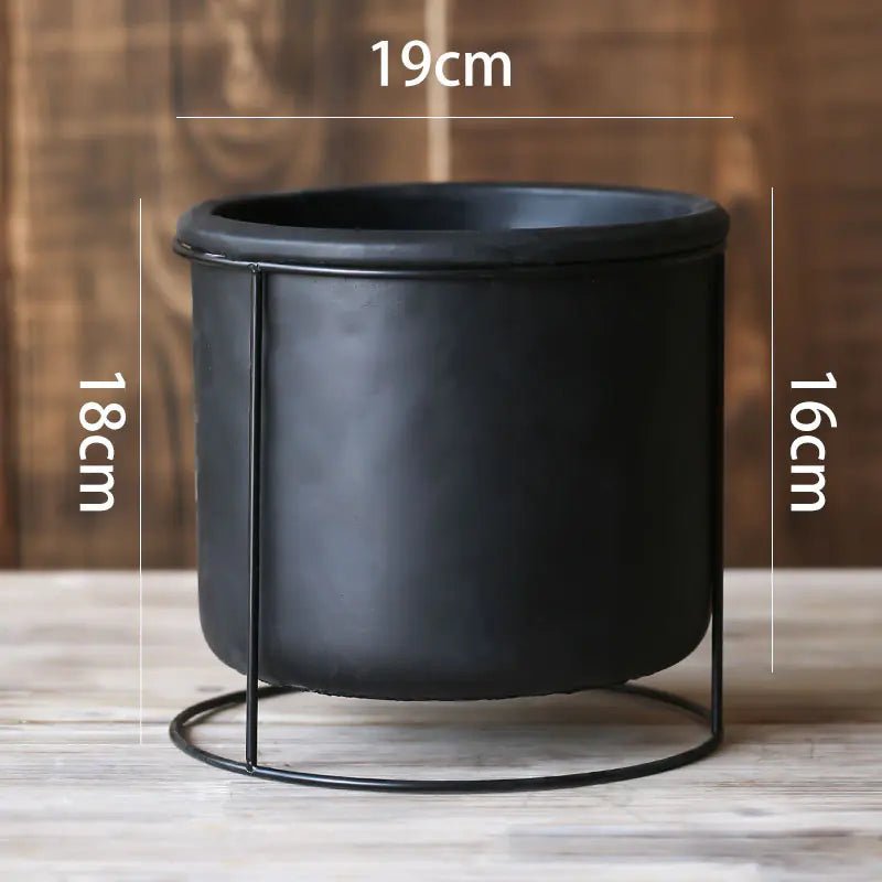 A large Decorative Succulent Planter with Iron Stand measuring 19cm in diameter. The overall height is 18cm.