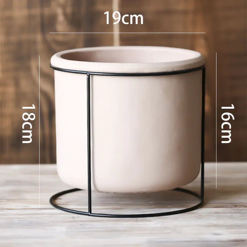 A large Decorative Succulent Planter with Iron Stand measuring 19cm in diameter. The overall height is 18cm.